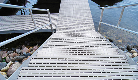 Stairs and a dock with titan classic over the water.