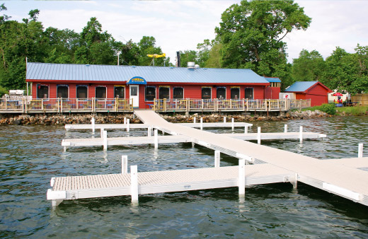 A marine dock with titan decking in front of a restaurant.