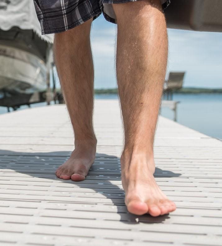 Barefoot walking on a dock made with titan classic. 